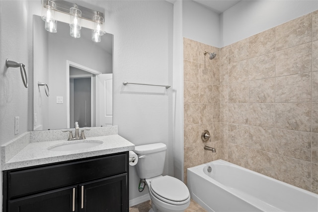 full bathroom with vanity, toilet, and tiled shower / bath