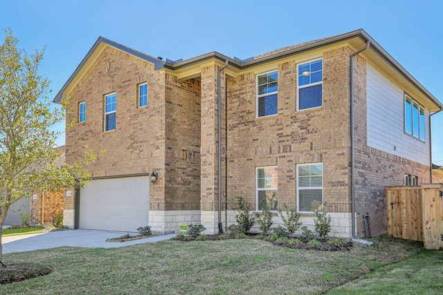 view of front of home with a garage and a front yard