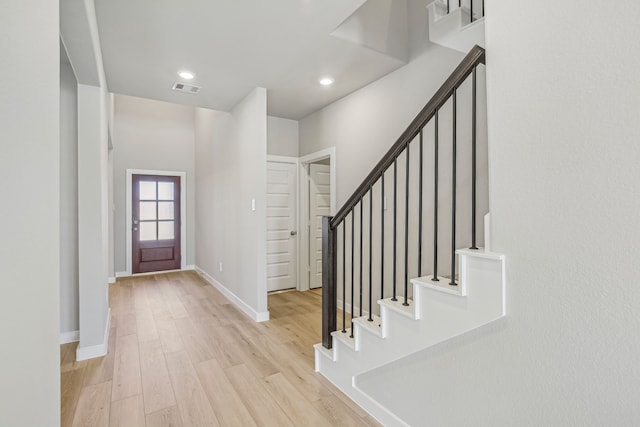 entrance foyer with light hardwood / wood-style flooring