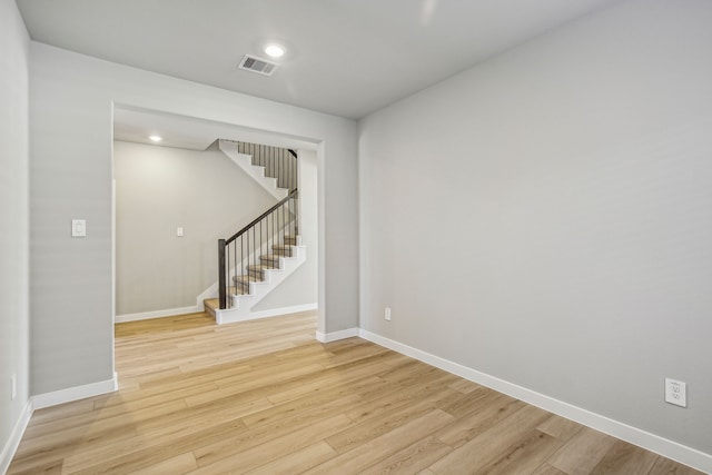 unfurnished room featuring light hardwood / wood-style floors