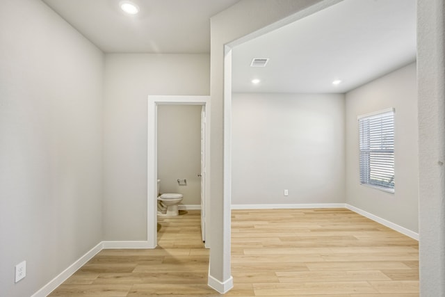 spare room with light hardwood / wood-style flooring