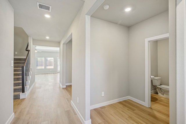 hall with light hardwood / wood-style flooring