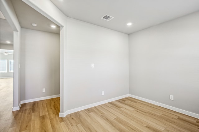 unfurnished room with ceiling fan and light hardwood / wood-style flooring