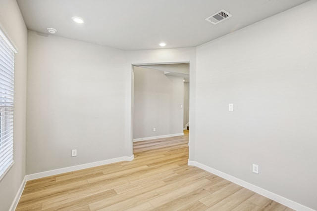 unfurnished room featuring light hardwood / wood-style flooring