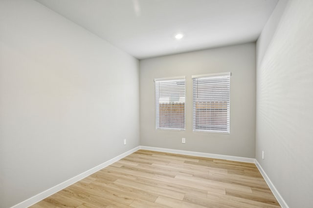 spare room featuring light hardwood / wood-style flooring