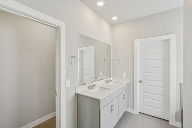 bathroom with vanity and tile patterned floors