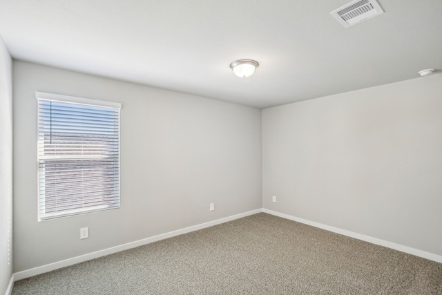 spare room with carpet floors