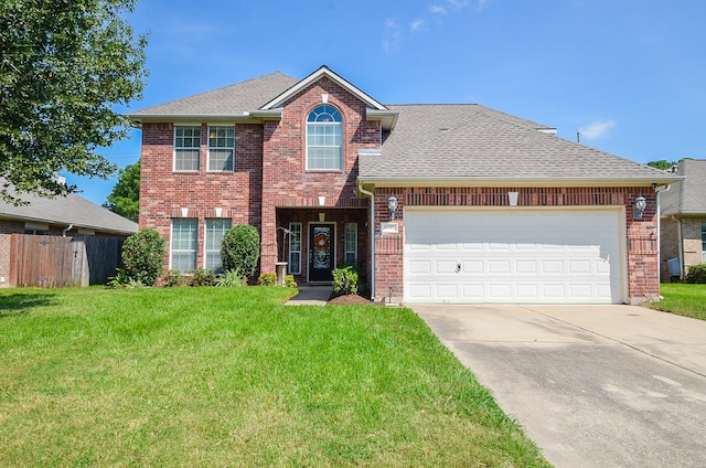 front of property featuring a garage and a front lawn