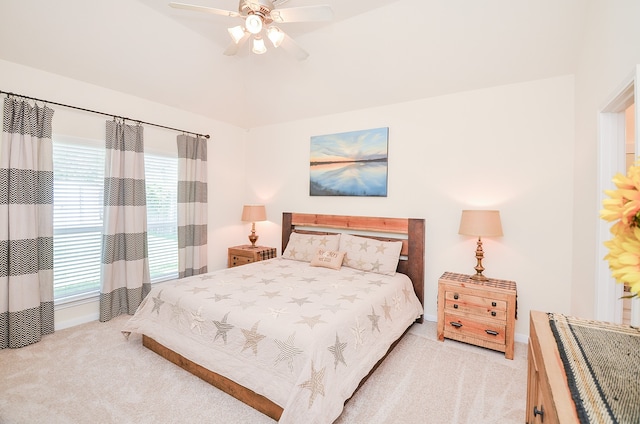 carpeted bedroom with multiple windows and ceiling fan