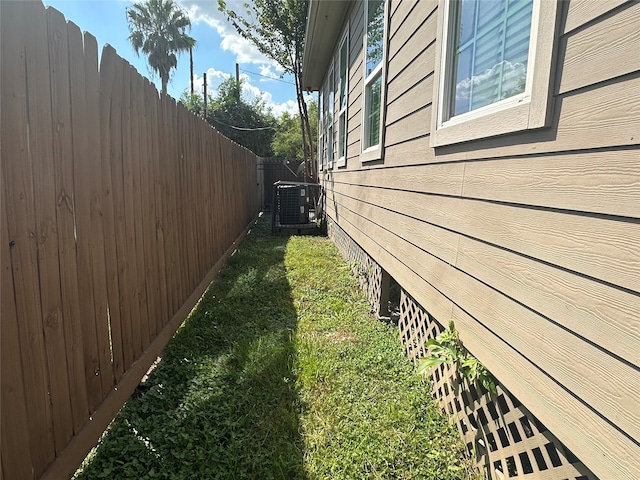 view of yard with central air condition unit