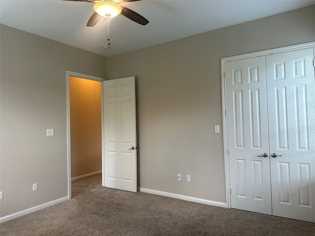 unfurnished bedroom with carpet, ceiling fan, and a closet