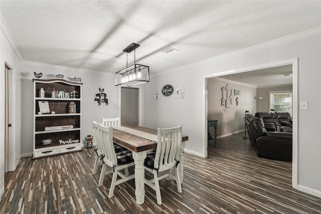 dining room featuring ornamental molding, a textured ceiling, and dark wood-type flooring