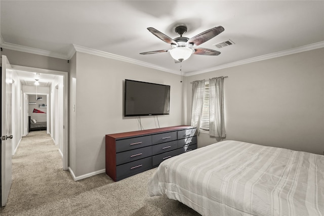 bedroom with ceiling fan, light colored carpet, and crown molding