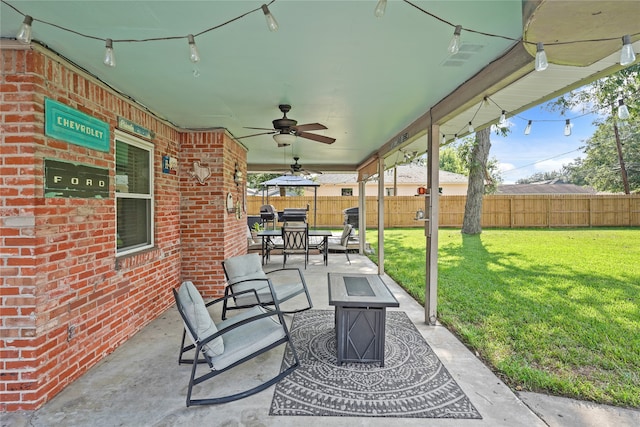 view of patio / terrace featuring a fire pit and ceiling fan