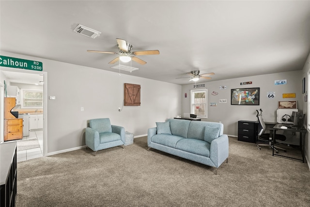 living room with carpet flooring and ceiling fan