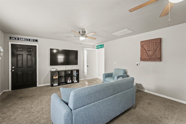 carpeted living room with ceiling fan