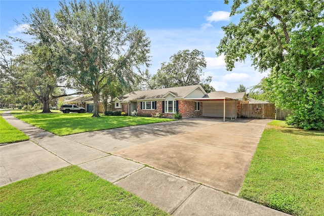 ranch-style house featuring a garage and a front lawn