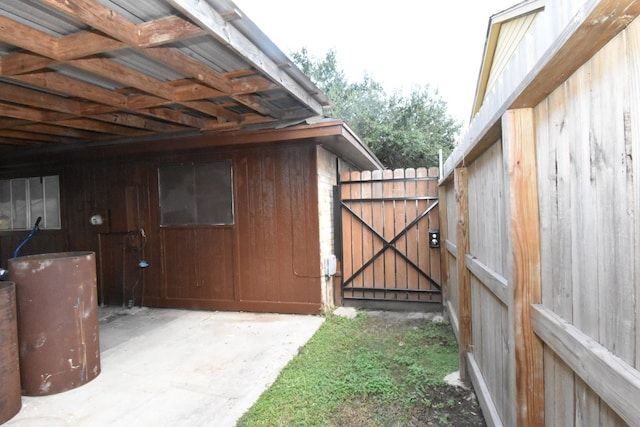 exterior space featuring water heater and a patio area