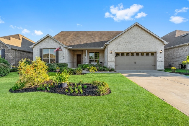 view of front facade featuring a garage and a front lawn