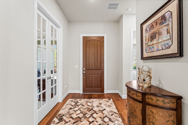 entryway featuring hardwood / wood-style flooring and a healthy amount of sunlight