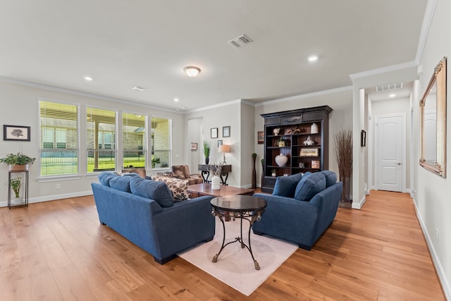 living room with light wood-type flooring and ornamental molding