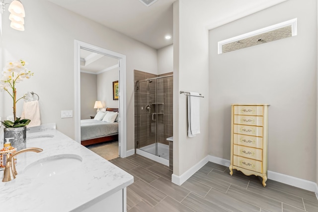 bathroom featuring vanity and an enclosed shower