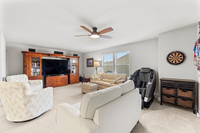 carpeted living room featuring ceiling fan