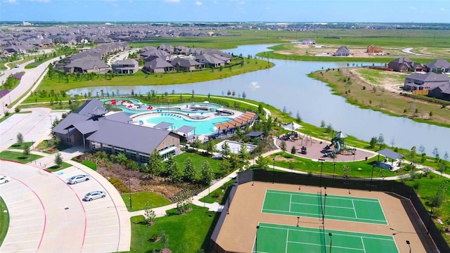 birds eye view of property featuring a water view