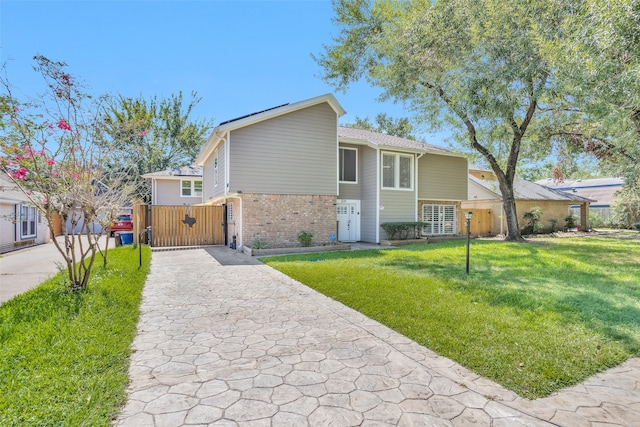 view of front of home with a front lawn