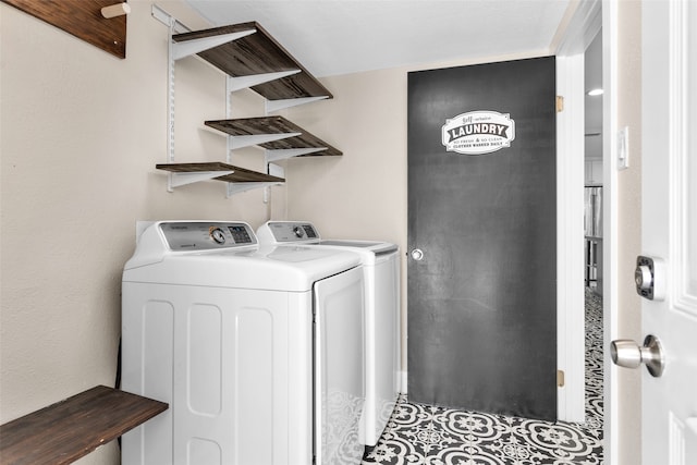 laundry room with washing machine and clothes dryer