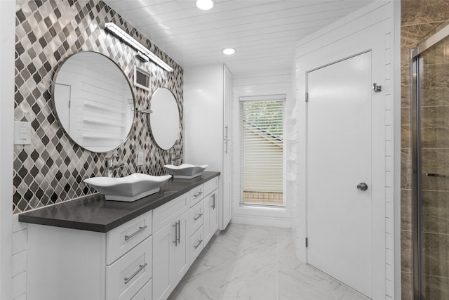 331 Cypresswood Dr, Spring, TX 77388 - bathroom with marble look tiles, recessed lighting, double vanity, and a tile shower