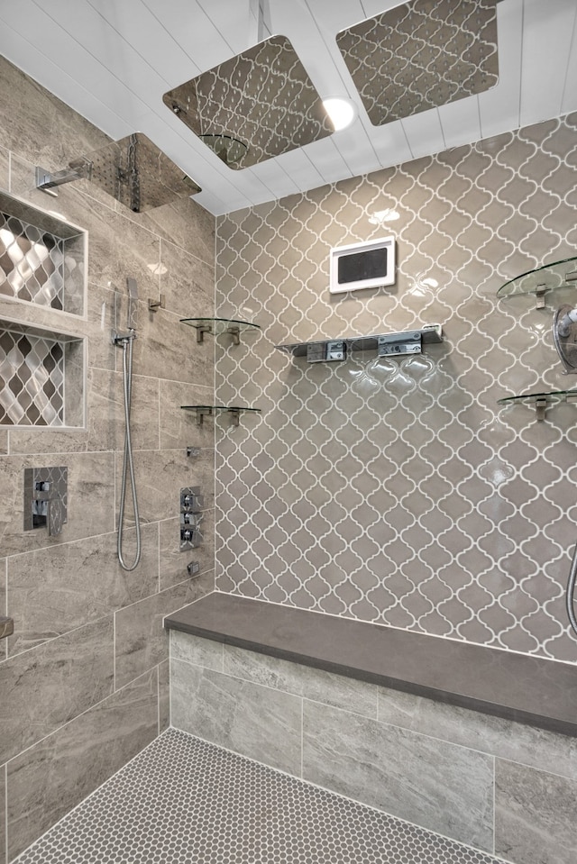 bathroom with a tile shower