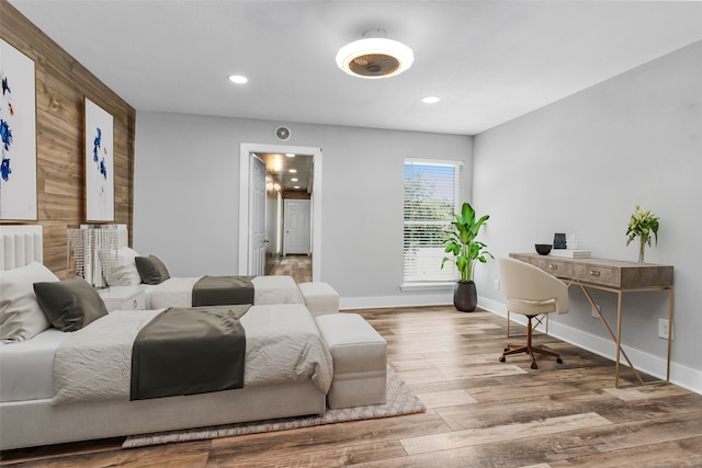 bedroom with hardwood / wood-style floors