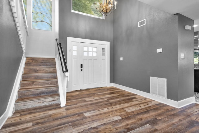 331 Cypresswood Dr, Spring, TX 77388 - entrance foyer featuring a chandelier, wood finished floors, stairway, baseboards, and a high ceiling