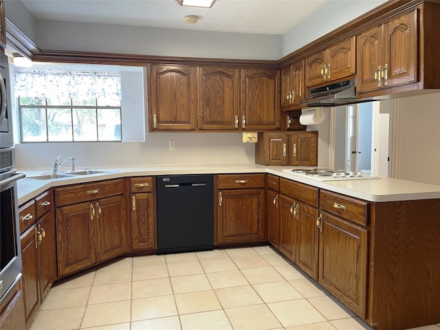 kitchen featuring black dishwasher, kitchen peninsula, light tile patterned floors, white gas stovetop, and sink