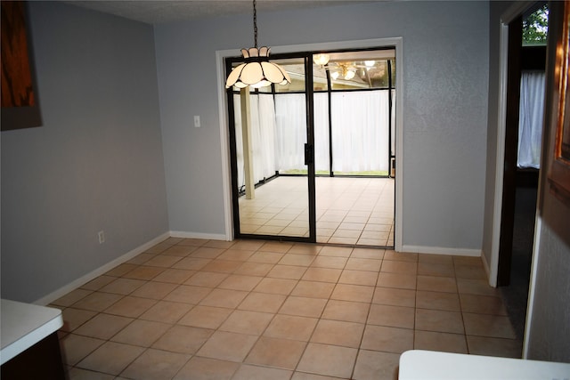 unfurnished dining area with light tile patterned floors