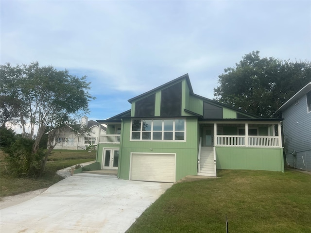 view of front of property with a garage and a front yard