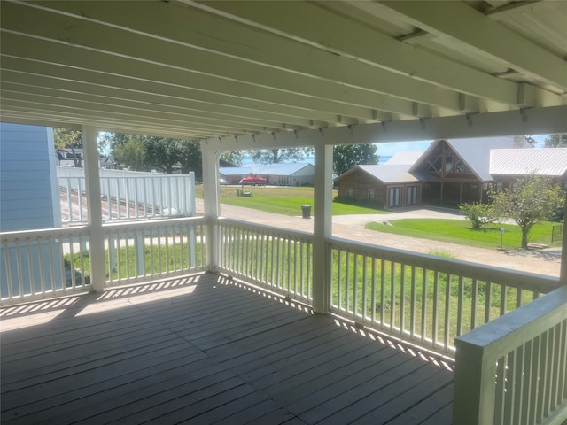 wooden deck with a lawn