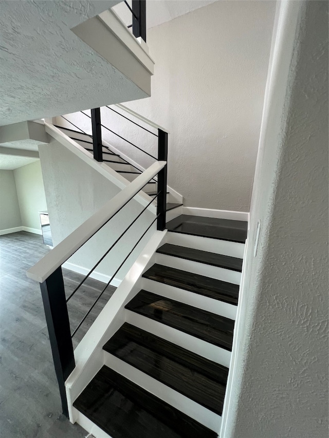 stairway with wood-type flooring