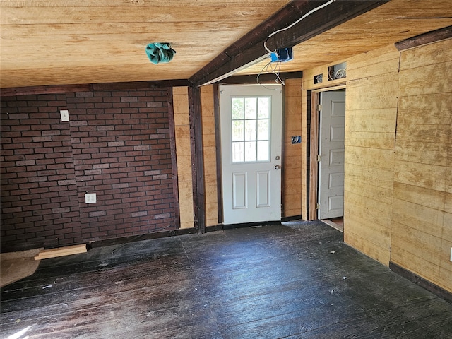 interior space featuring wood ceiling, brick wall, and hardwood / wood-style floors