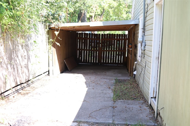 exterior space with a carport