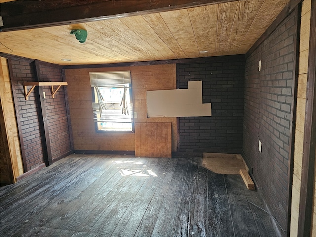 unfurnished living room with brick wall, dark hardwood / wood-style flooring, and wooden ceiling