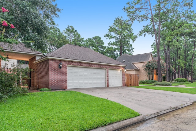 view of front facade with a front lawn and a garage