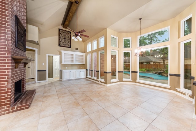 unfurnished living room with high vaulted ceiling, a brick fireplace, light tile patterned floors, beamed ceiling, and ceiling fan