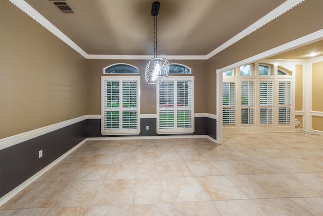 empty room featuring ornamental molding