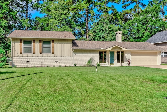 view of front facade featuring a garage and a front lawn