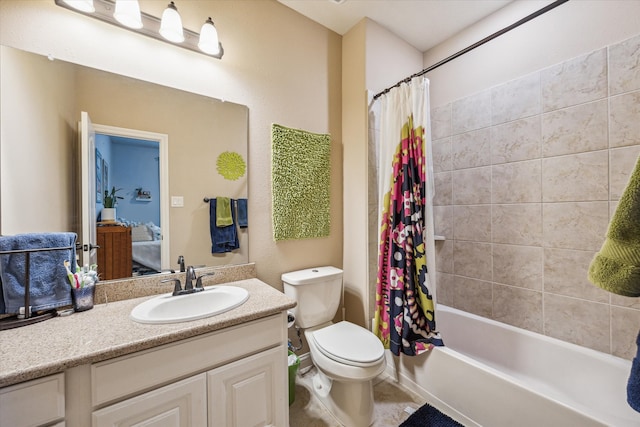 full bathroom with vanity, toilet, and shower / bath combo with shower curtain