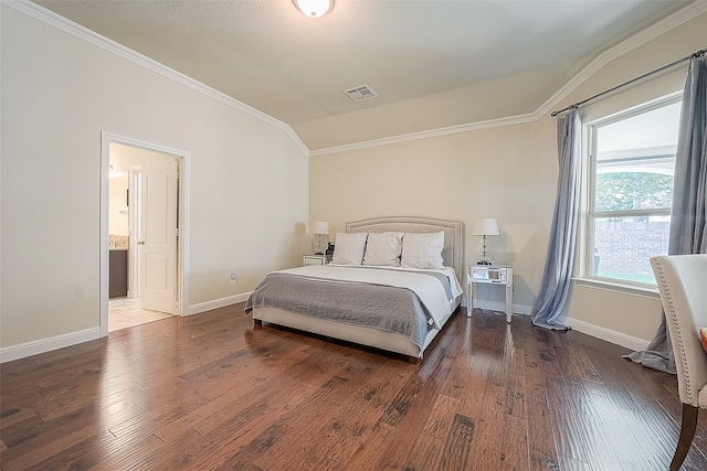 bedroom with ornamental molding, lofted ceiling, dark hardwood / wood-style floors, and ensuite bathroom