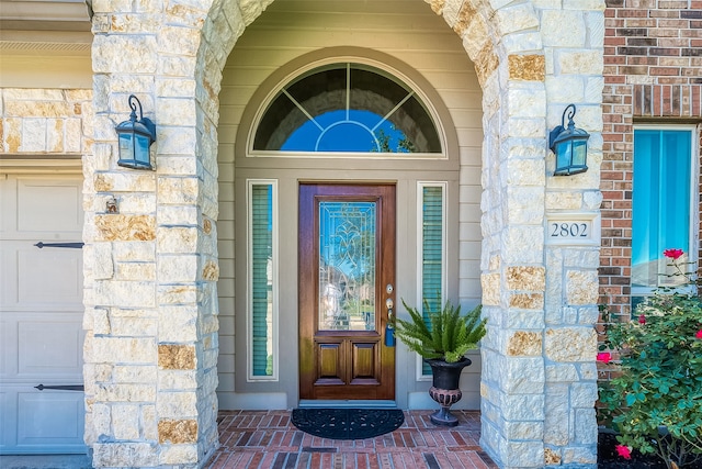 property entrance featuring a garage