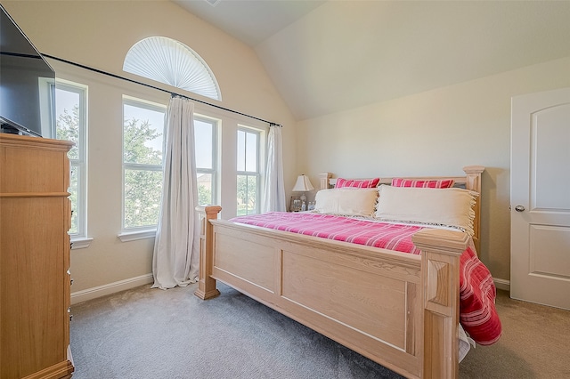 carpeted bedroom featuring vaulted ceiling